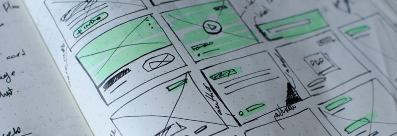 Paper sketches of web design elements